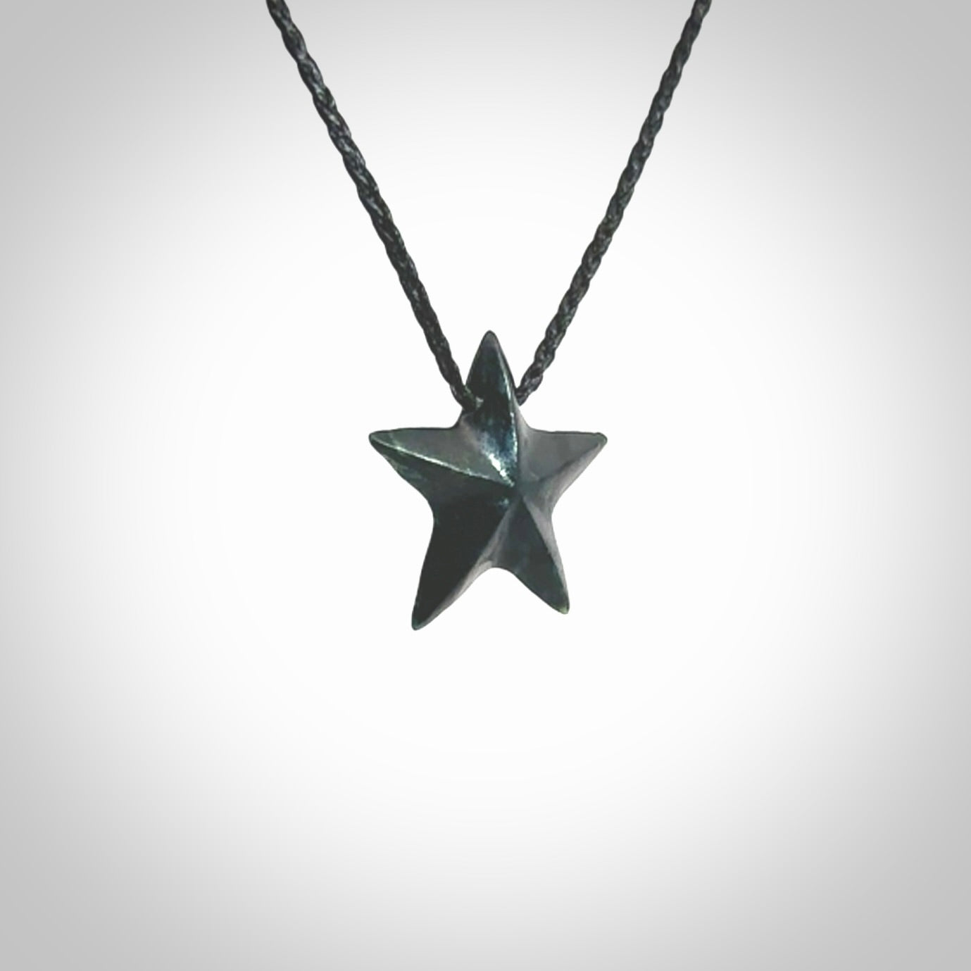 Hand carved black jade star pendant. Hand made black jade star pendant with adjustable cord.