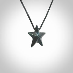 Hand carved black jade star pendant. Hand made black jade star pendant with adjustable cord.