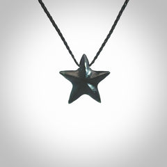 Hand carved black jade star pendant. Hand made black jade star pendant with adjustable cord.