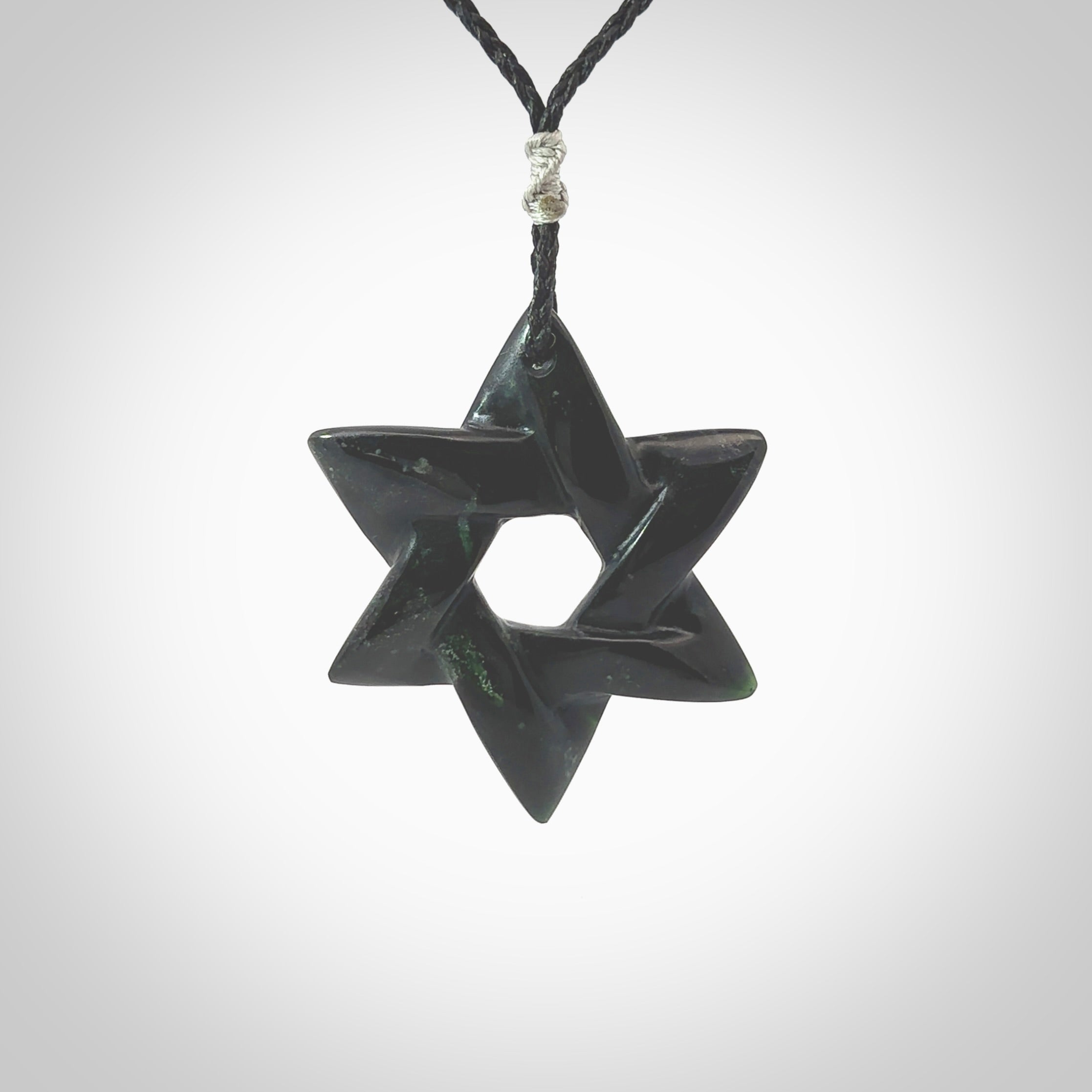 Hand carved New Zealand Tangiwai Pounamu Magen David necklace. Unique and creative art to wear from New Zealand Tangiwai Pounamu. Hand made New Zealand Tangiwai star of david pendant. Magen David pendant for men and women.