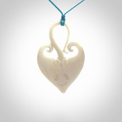 Hand carved large bone stingray pendant. Natural bone pendants from NZ Pacific. One only pendant provided with adjustable blue cord.