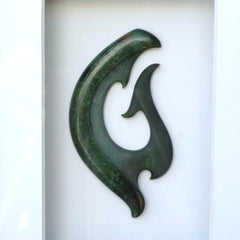 A hand carved large New Zealand Jade Koru necklace that has been framed and signed by artist Kerry Thompson. A large sized hand made koru necklace by New Zealand artist Kerry Thompson. One off framed work of art to wear. Delivered with Express Courier.