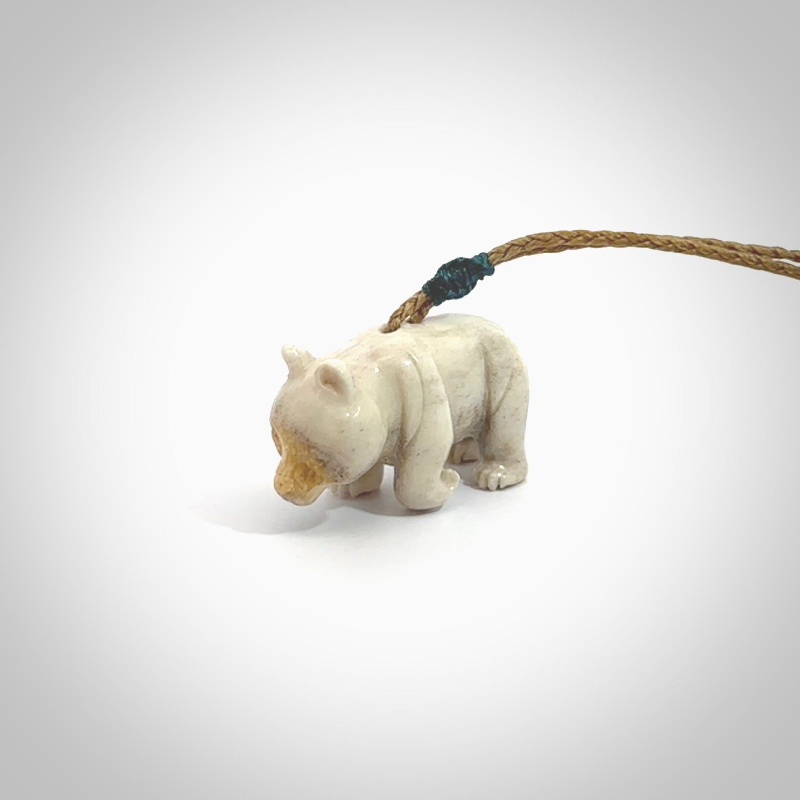 This picture shows a pendant that we designed in Deer Antler. It is a little Panda bear that has a walking stance and is carved in detail. A really attractive and eye-catching piece of handmade jewellery. The cord is hand plaited braid and the length can be adjusted.