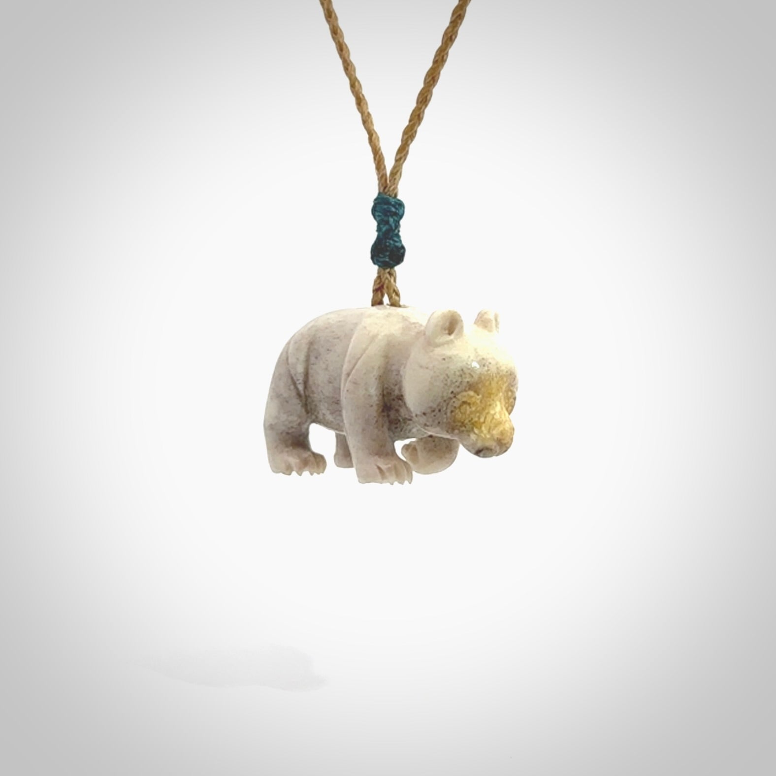 This picture shows a pendant that we designed in Deer Antler. It is a little Panda bear that has a walking stance and is carved in detail. A really attractive and eye-catching piece of handmade jewellery. The cord is hand plaited braid and the length can be adjusted.