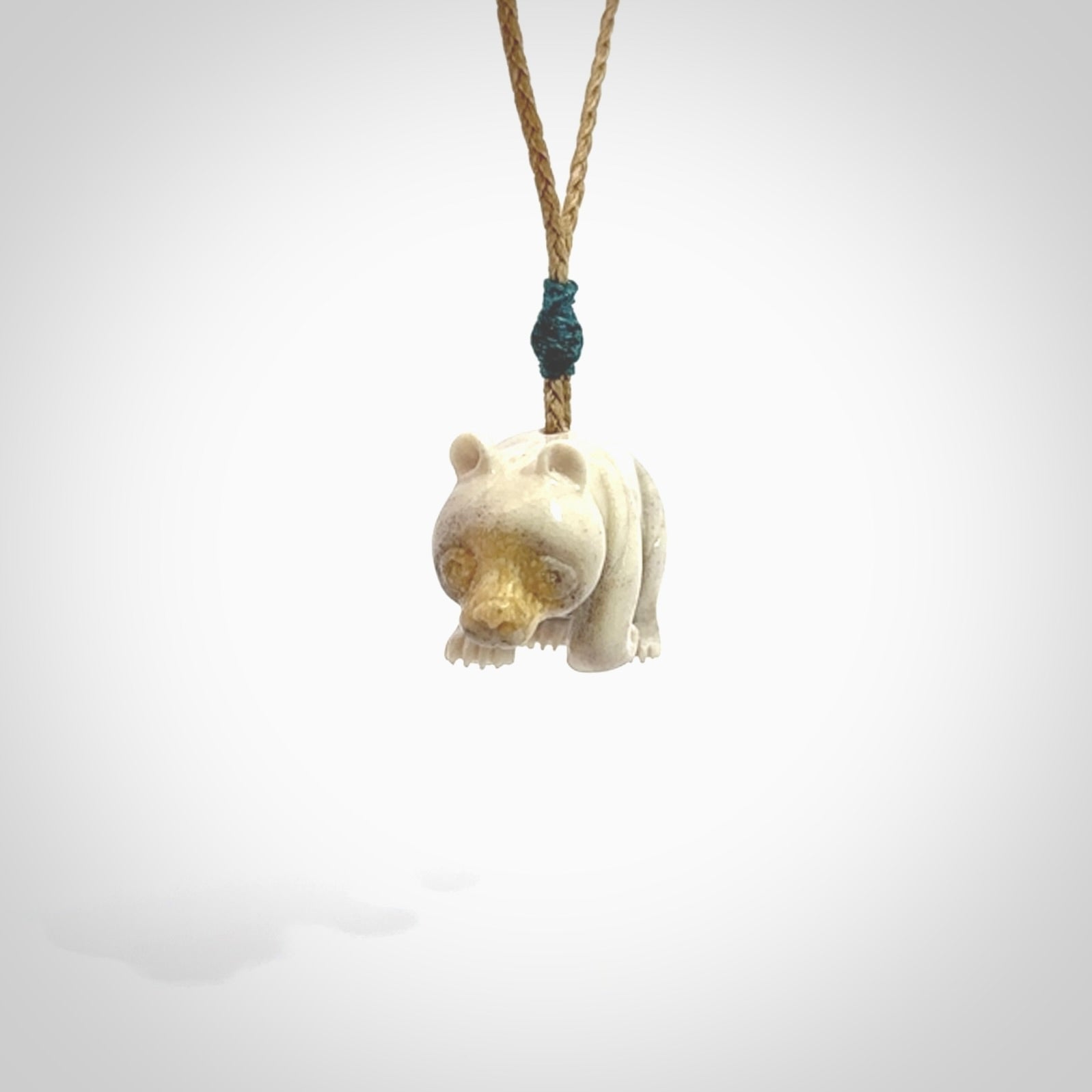 This picture shows a pendant that we designed in Deer Antler. It is a little Panda bear that has a walking stance and is carved in detail. A really attractive and eye-catching piece of handmade jewellery. The cord is hand plaited braid and the length can be adjusted.