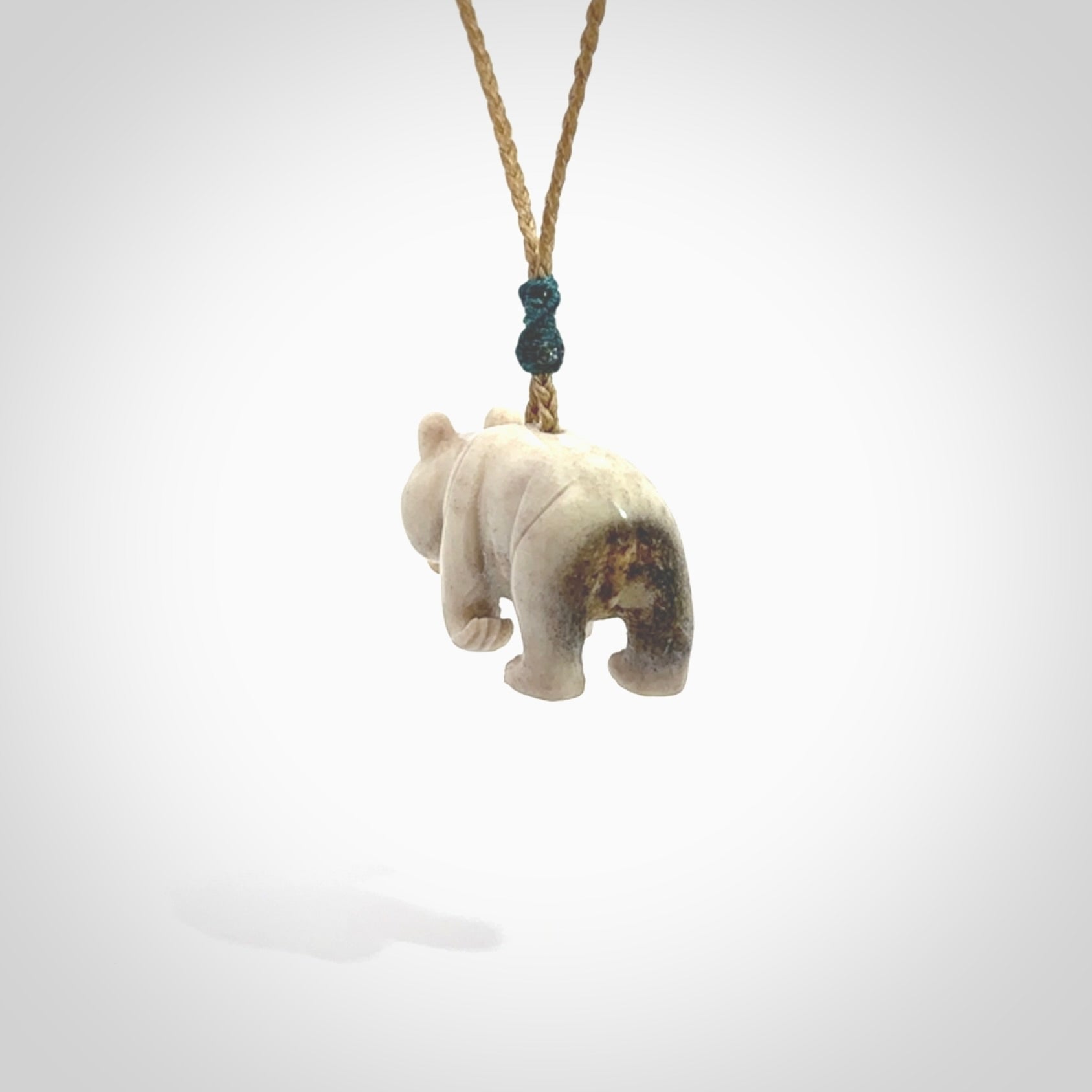 This picture shows a pendant that we designed in Deer Antler. It is a little Panda bear that has a walking stance and is carved in detail. A really attractive and eye-catching piece of handmade jewellery. The cord is hand plaited braid and the length can be adjusted.