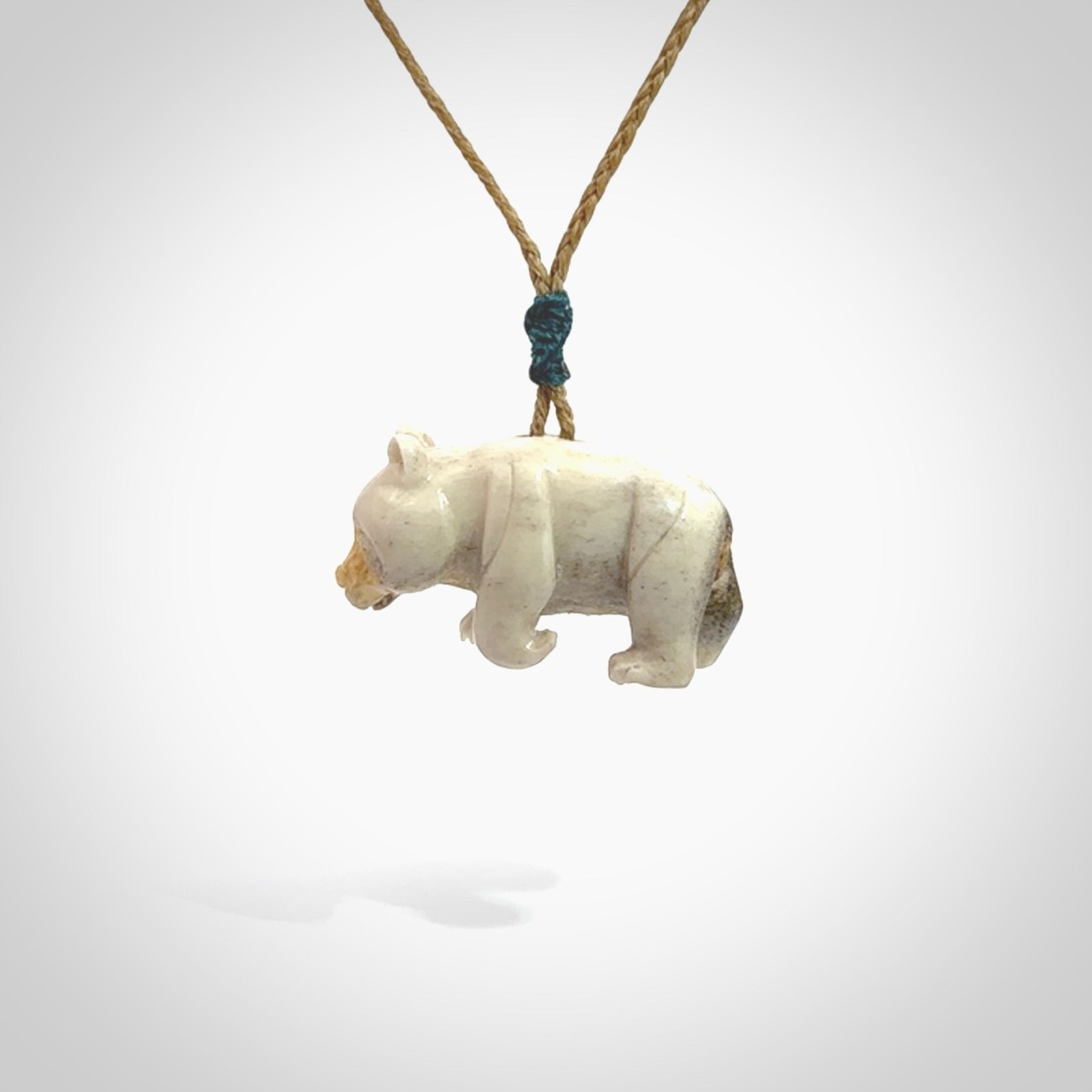 This picture shows a pendant that we designed in Deer Antler. It is a little Panda bear that has a walking stance and is carved in detail. A really attractive and eye-catching piece of handmade jewellery. The cord is hand plaited braid and the length can be adjusted.