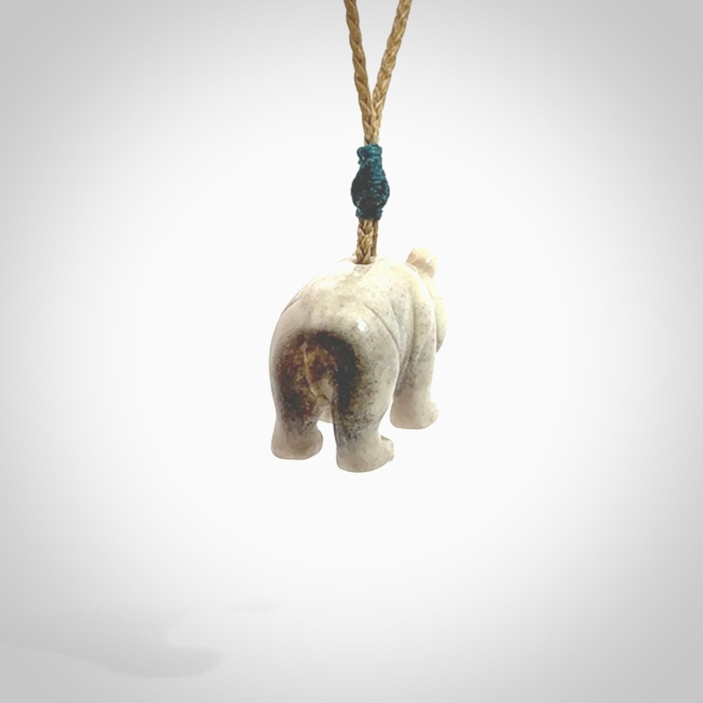 This picture shows a pendant that we designed in Deer Antler. It is a little Panda bear that has a walking stance and is carved in detail. A really attractive and eye-catching piece of handmade jewellery. The cord is hand plaited braid and the length can be adjusted.