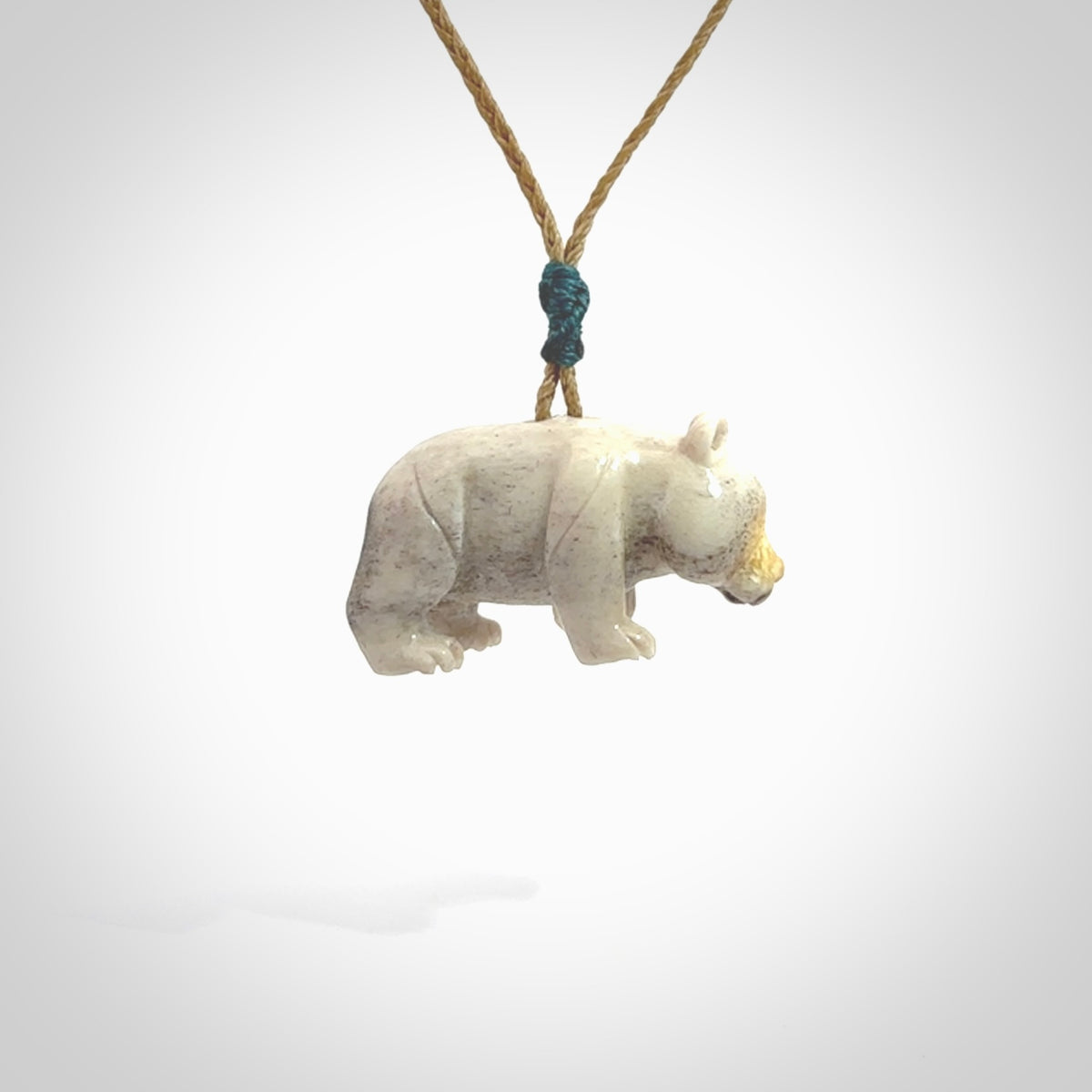 This picture shows a pendant that we designed in Deer Antler. It is a little Panda bear that has a walking stance and is carved in detail. A really attractive and eye-catching piece of handmade jewellery. The cord is hand plaited braid and the length can be adjusted.