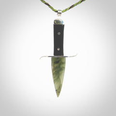 A striking hand carved knife pendant. These are carved with a green jade head and a hardwood handle. The cords are hand plaited in our waxed polyester which is robust, strong and durable. We ship these worldwide with express courier.