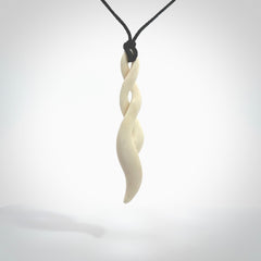 A handcarved masterpiece. A complex twist pendant carved from bone by Yuri Terenyi for NZ Pacific. This is a true piece of wearable art which is collectible.