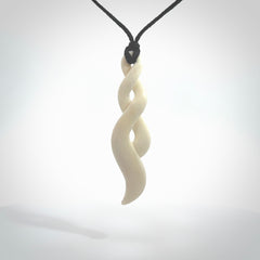 A handcarved masterpiece. A complex twist pendant carved from bone by Yuri Terenyi for NZ Pacific. This is a true piece of wearable art which is collectible.