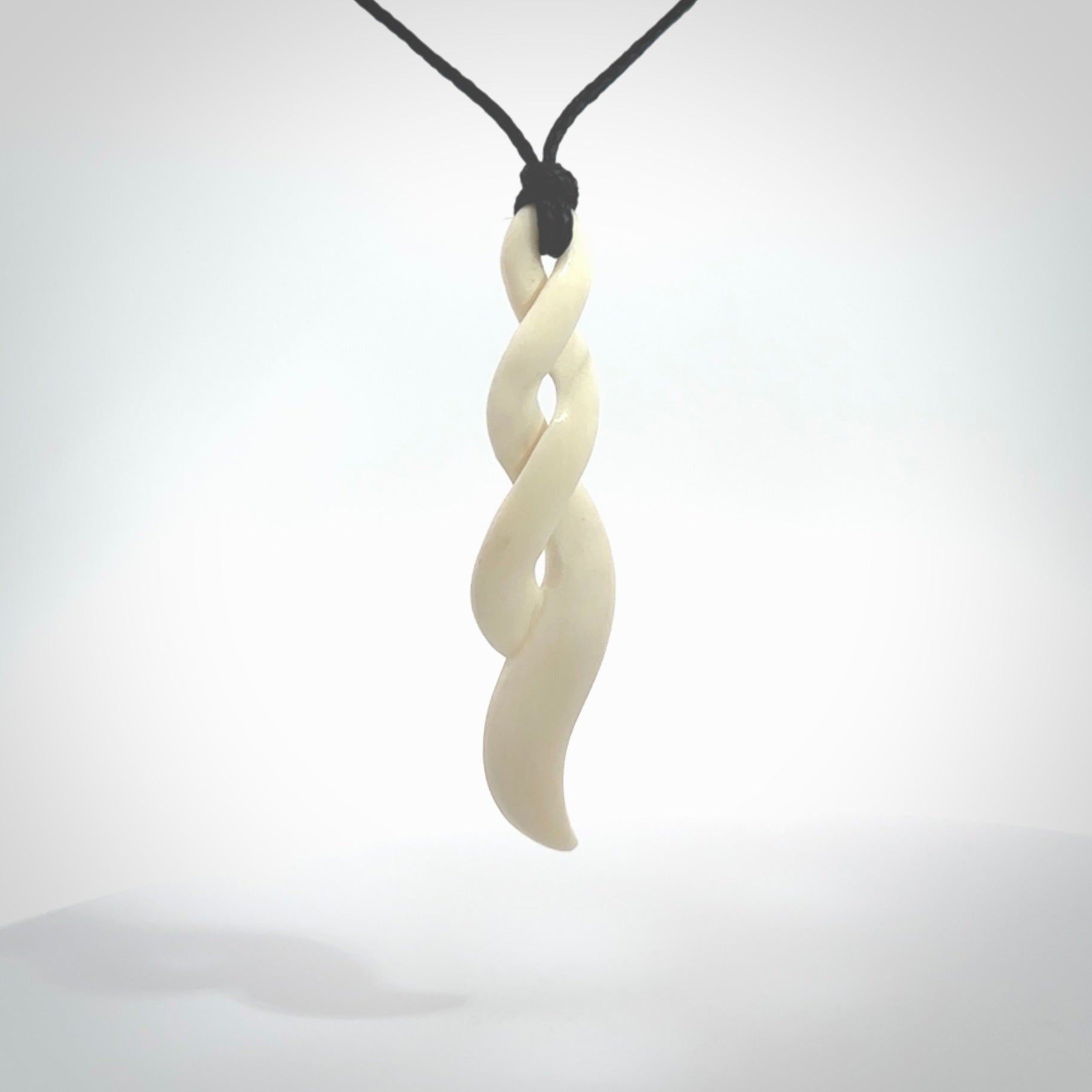 A handcarved masterpiece. A complex twist pendant carved from bone by Yuri Terenyi for NZ Pacific. This is a true piece of wearable art which is collectible.