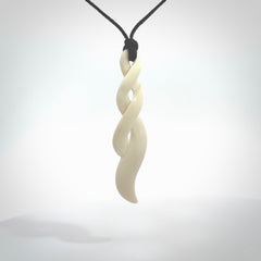 A handcarved masterpiece. A complex twist pendant carved from bone by Yuri Terenyi for NZ Pacific. This is a true piece of wearable art which is collectible.