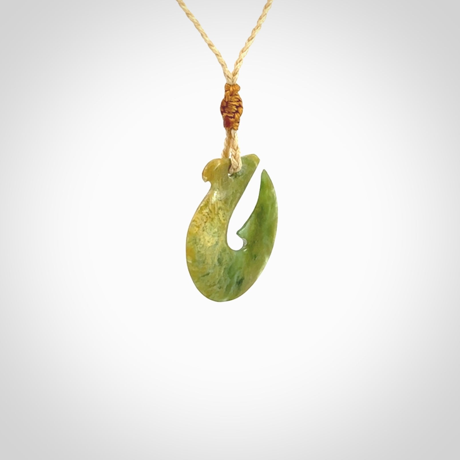 Hand carved New Zealand Jade Hook Pendant. Hand made Jade Hook, matau necklace provided with adjustable cord.