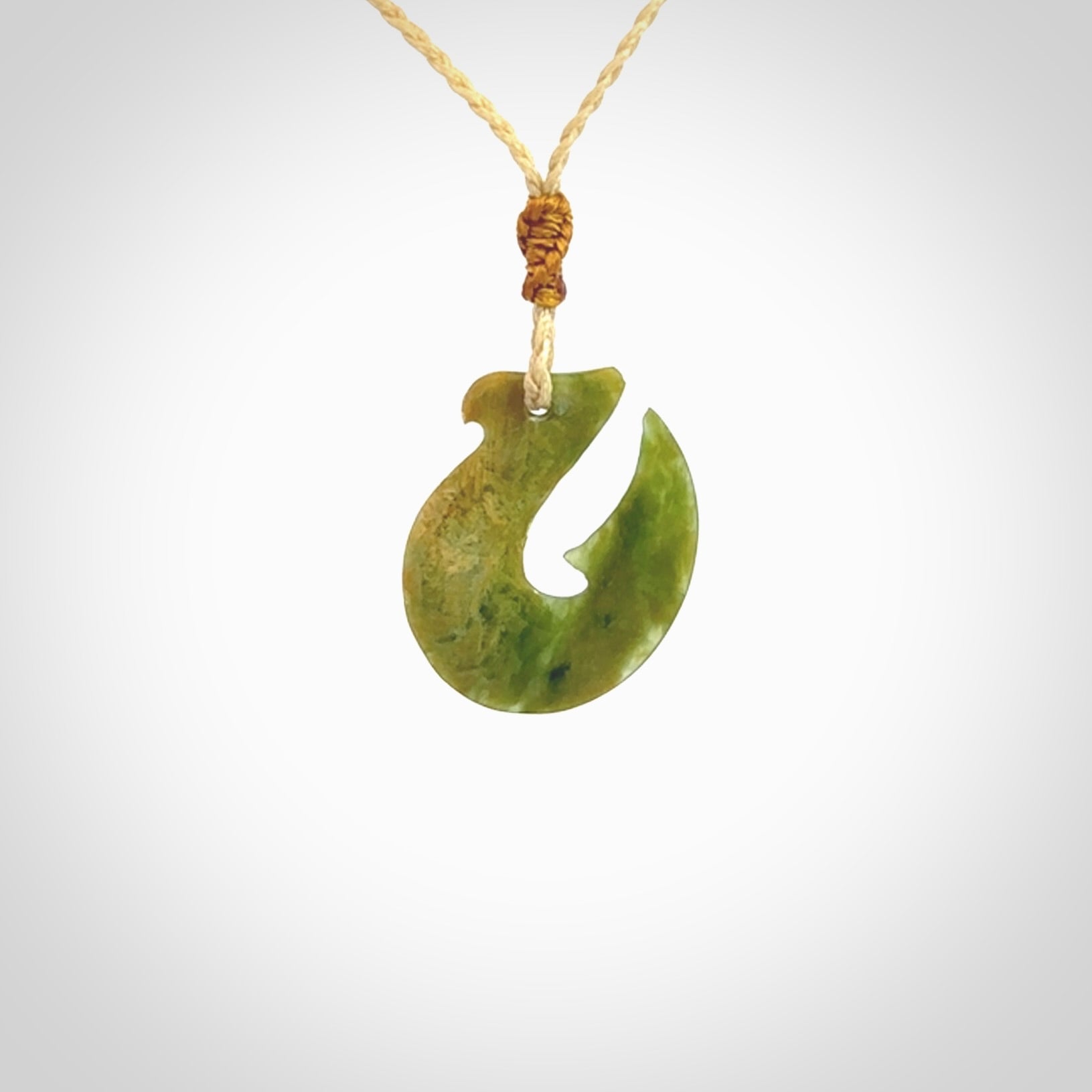 Hand carved New Zealand Jade Hook Pendant. Hand made Jade Hook, matau necklace provided with adjustable cord.