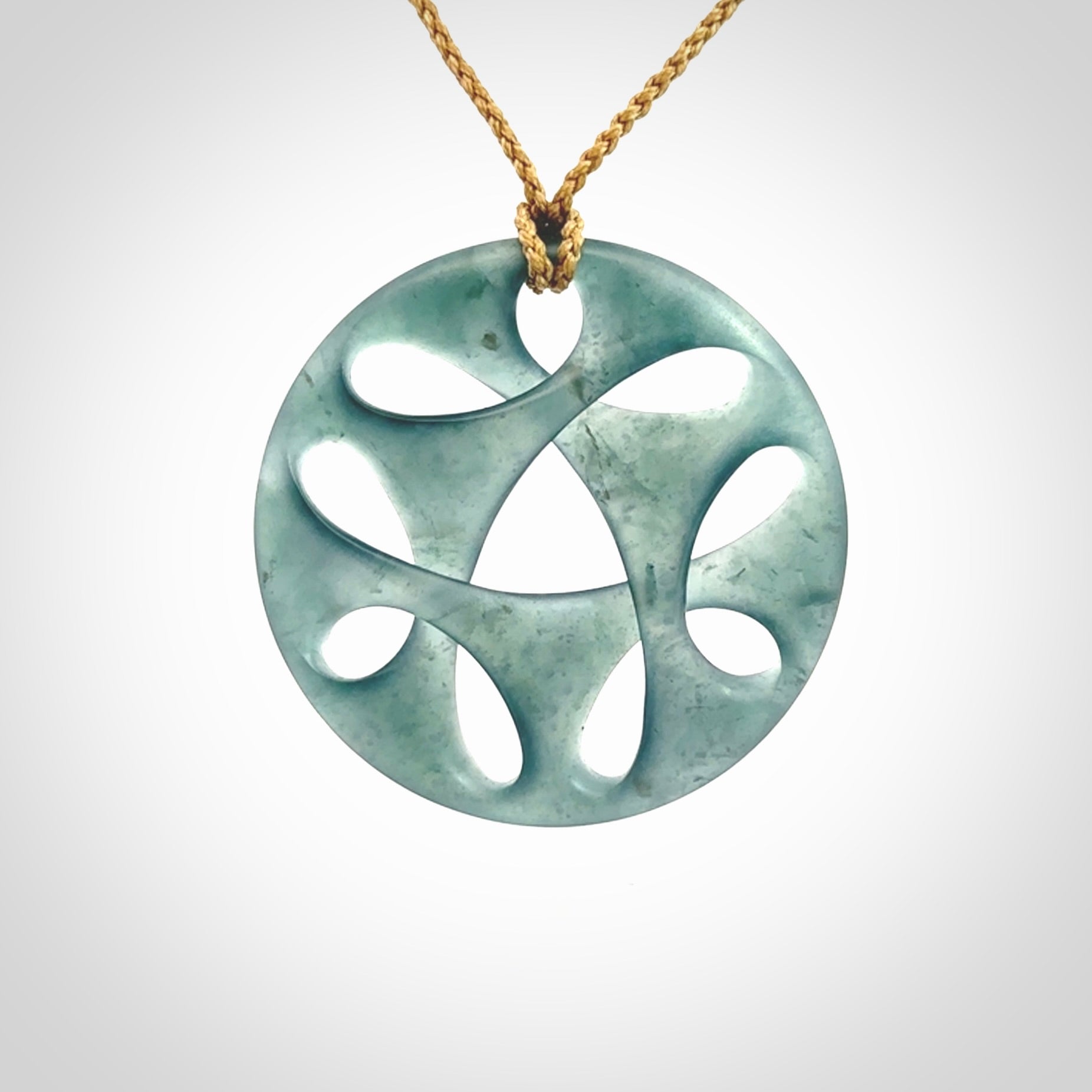 This large piece is a hand carved complex twist pendant. Kerry carved this from Guatemalan Jade. It is a gorgeous blue colour and is an artistic piece of jewellery. Hand made by Kerry Thompson and delivered to you in a kete pouch.