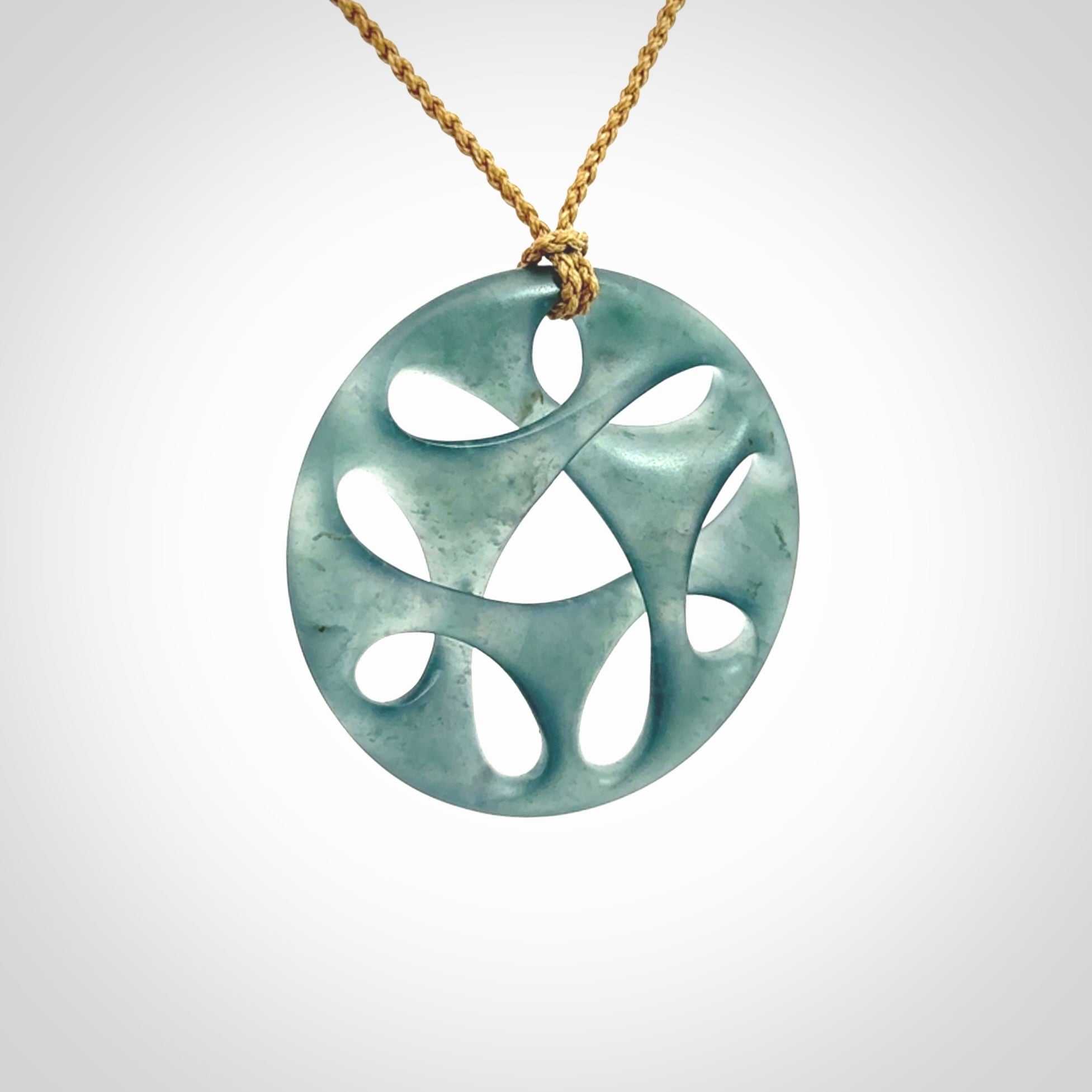 This large piece is a hand carved complex twist pendant. Kerry carved this from Guatemalan Jade. It is a gorgeous blue colour and is an artistic piece of jewellery. Hand made by Kerry Thompson and delivered to you in a kete pouch.