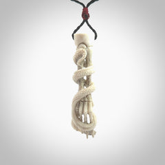 Hand carved deer antler skeleton hand with snake pendant. Hand carved by NZ Pacific. Free postage worldwide. Hand made skeleton hand with snake necklace from deer antler. Skeleton hand with snake necklace for men and women.