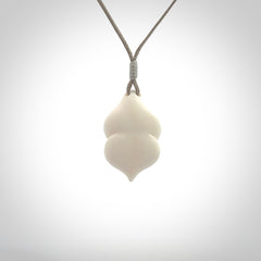 Hand carved goddess pendant. Venus of Willendorf pendant carved in bone. Made by NZ Pacific. Bone jewellery for sale online.