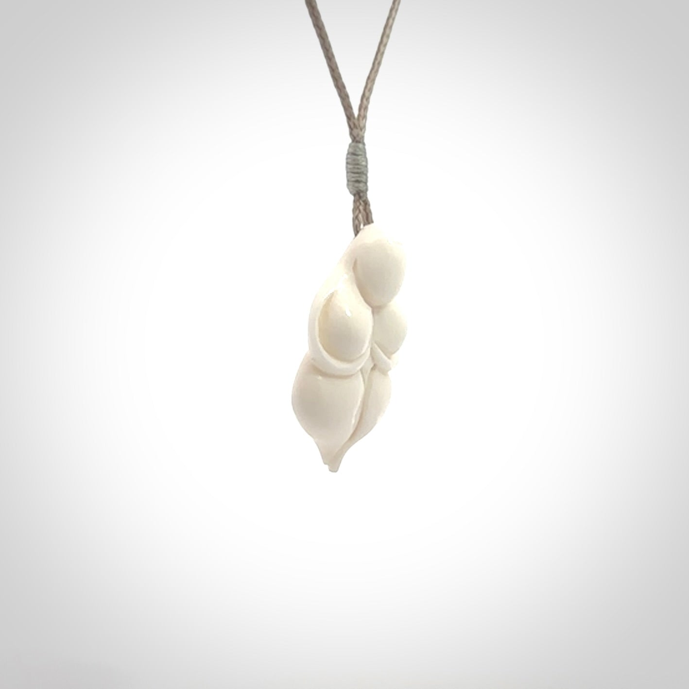 Hand carved goddess pendant. Venus of Willendorf pendant carved in bone. Made by NZ Pacific. Bone jewellery for sale online.