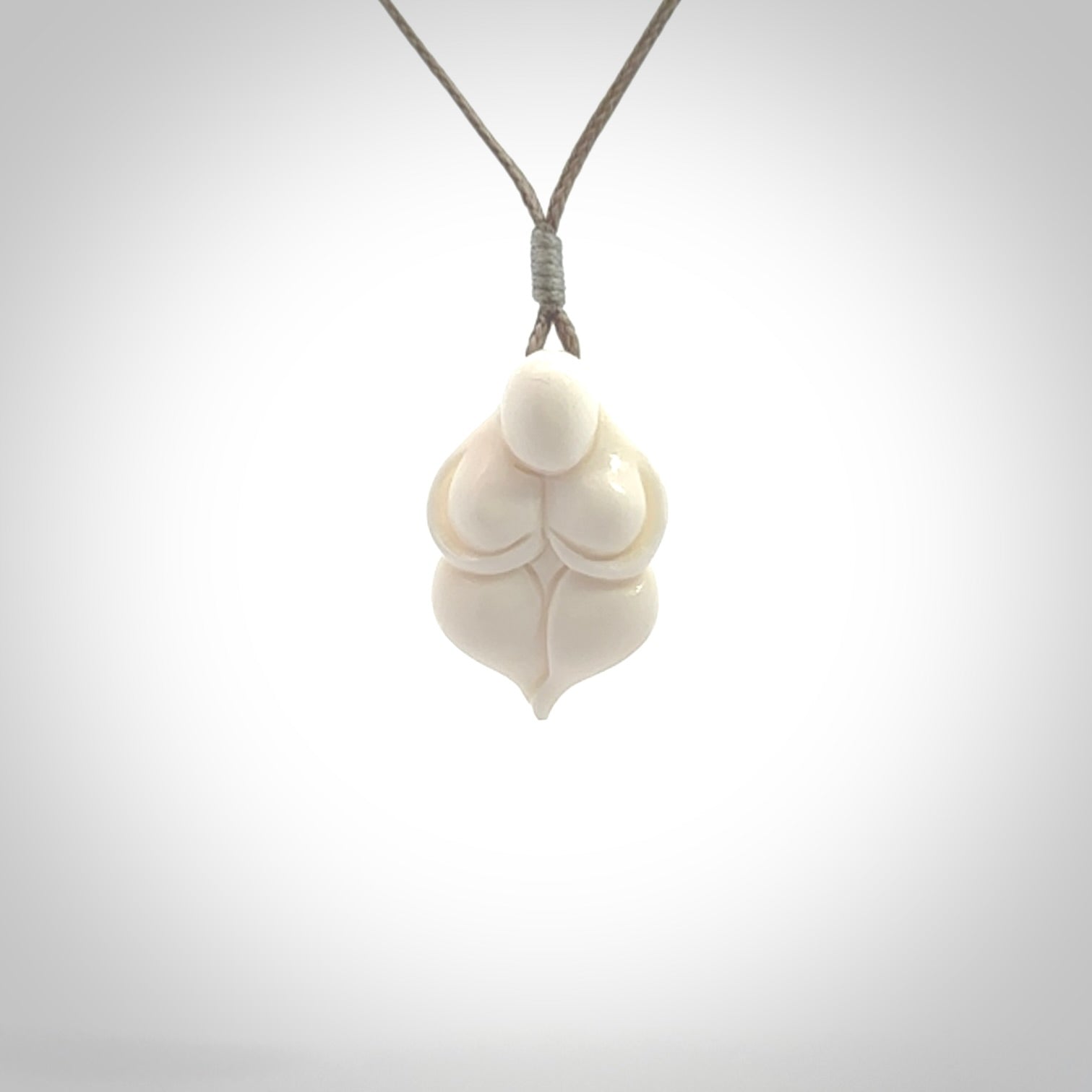 Hand carved goddess pendant. Venus of Willendorf pendant carved in bone. Made by NZ Pacific. Bone jewellery for sale online.