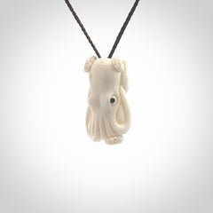 This is a beautiful little hand carved octopus pendant. It is a very cute little pendant that we have carved in natural, untreated bone. We provide these with blue or brown adjustable cords and shipping is included worldwide so there are no hidden costs when you reach checkout. Hand carved jewellery by NZ Pacific for sale online.