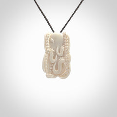 This is a beautiful little hand carved octopus pendant. It is a very cute little pendant that we have carved in natural, untreated bone. We provide these with blue or brown adjustable cords and shipping is included worldwide so there are no hidden costs when you reach checkout. Hand carved jewellery by NZ Pacific for sale online.