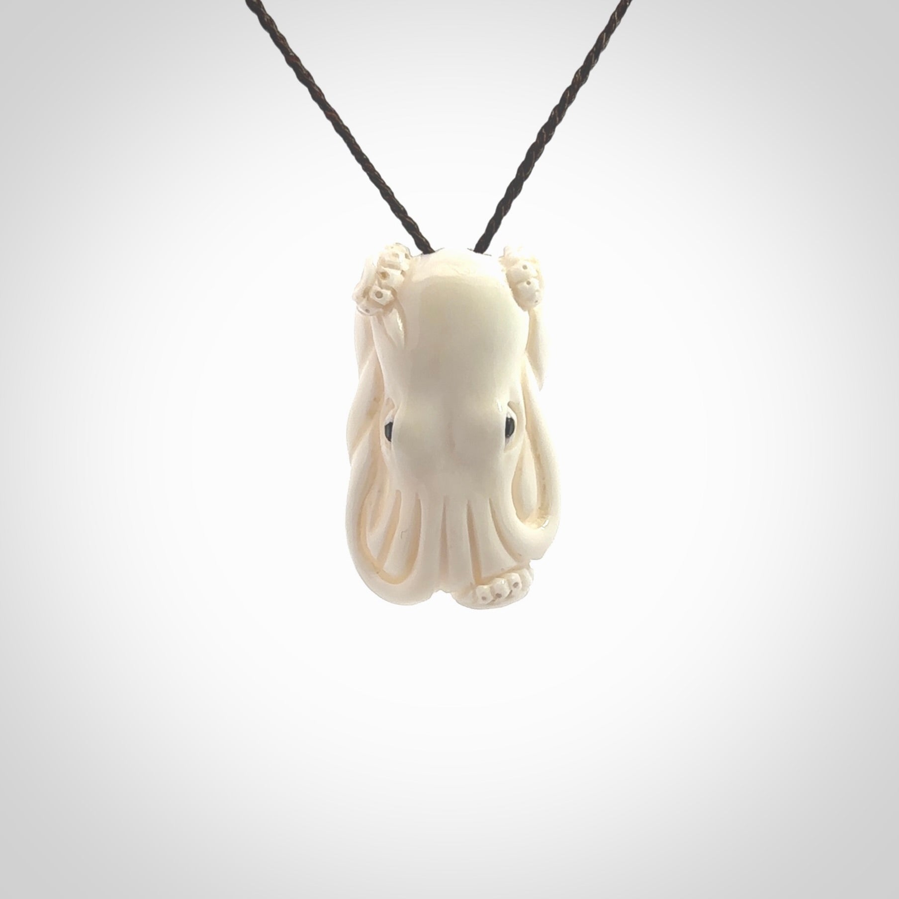 This is a beautiful little hand carved octopus pendant. It is a very cute little pendant that we have carved in natural, untreated bone. We provide these with blue or brown adjustable cords and shipping is included worldwide so there are no hidden costs when you reach checkout. Hand carved jewellery by NZ Pacific for sale online.