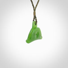 Hand carved New Zealand jade dog whistle. Carved for NZ Pacific by master carver Ross Crump. Jade dog whistle pendant provided with adjustable cord and delivered with express courier.