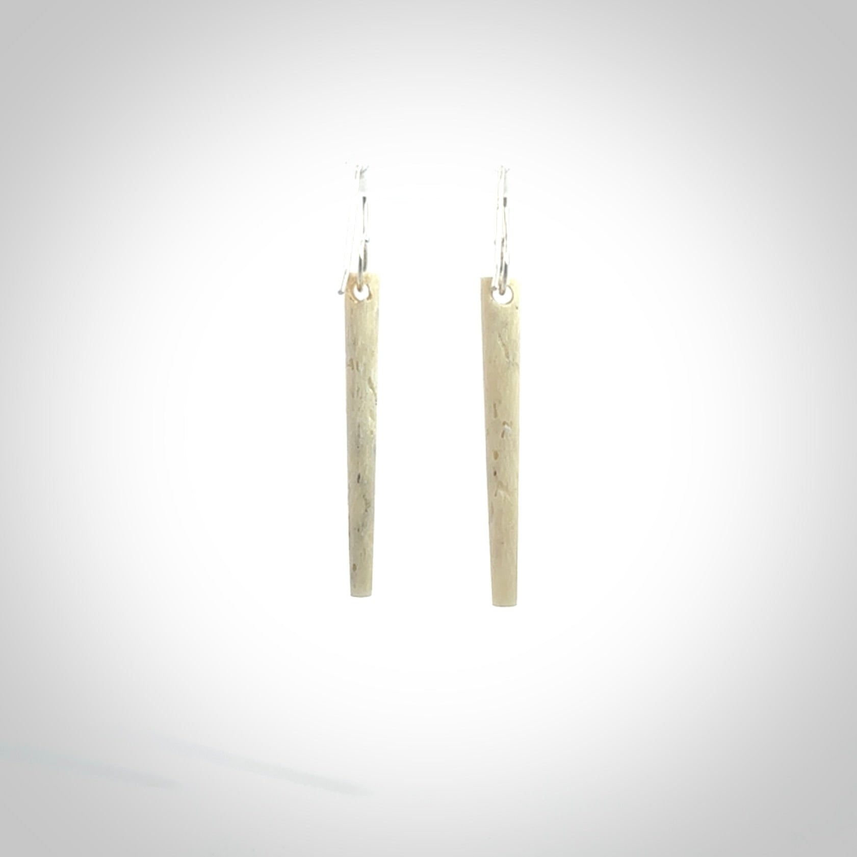 Hand carved medium whalebone drop earrings hand made by Kristal Thompson. One only large whale bone drop earrings. Real whale bone art to wear. Free Shipping worldwide. One pair only, delivered in a kete pouch.