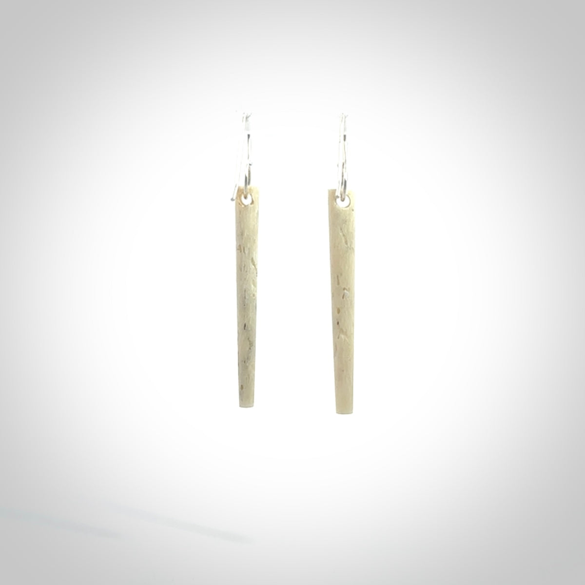 Hand carved medium whalebone drop earrings hand made by Kristal Thompson. One only large whale bone drop earrings. Real whale bone art to wear. Free Shipping worldwide. One pair only, delivered in a kete pouch.