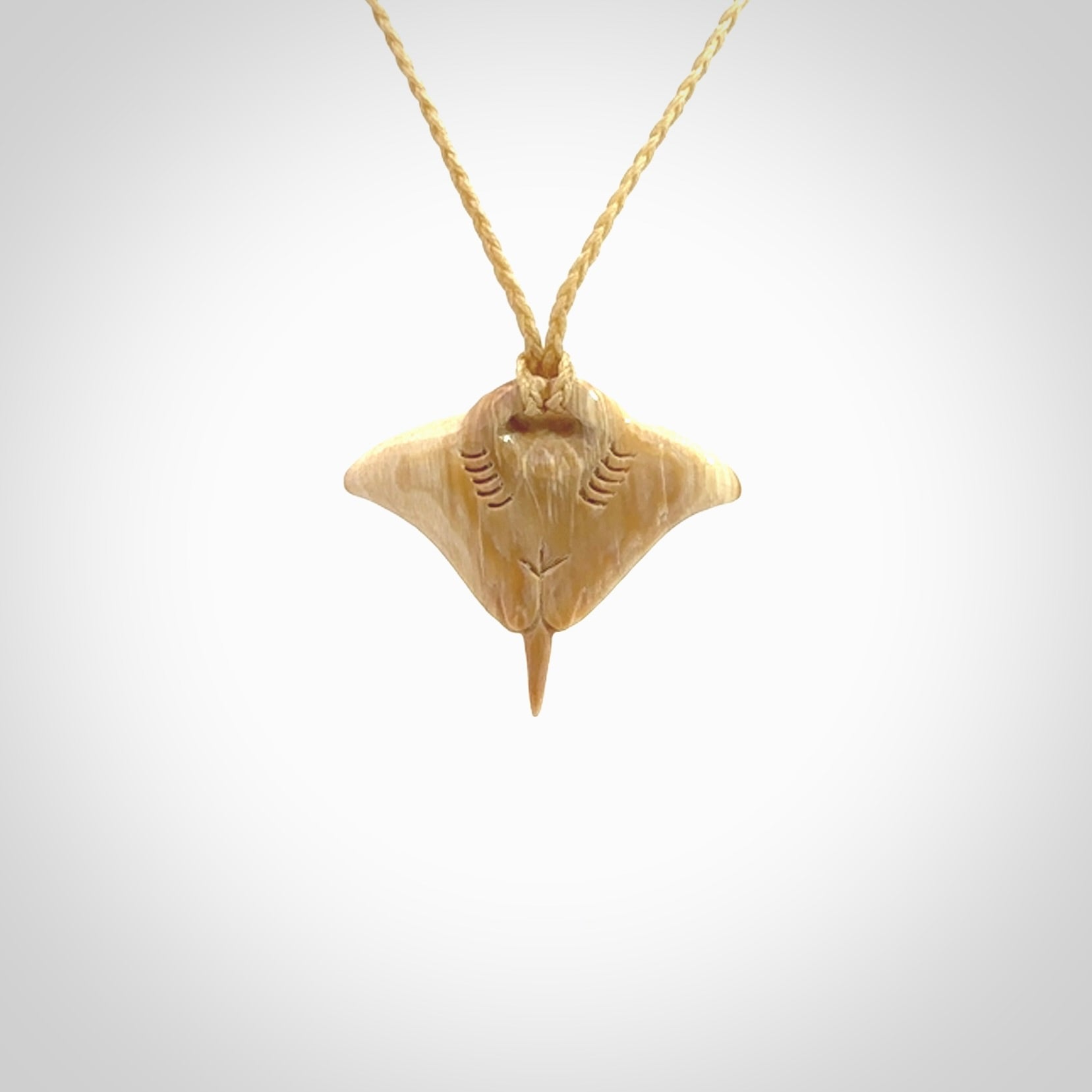 Woolly mammoth tusk manta ray pendant. Hand carved Mammoth Tusk manta ray pendant. Provided with adjustable cord.