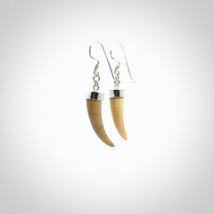 Hand made mammoth tusk drop earrings. Made by NZ Pacific - handmade jewellery for sale online. Woolly Mammoth Tusk fang style earrings, packaged in a woven kete pouch.