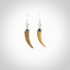 Hand made mammoth tusk drop earrings. Made by NZ Pacific - handmade jewellery for sale online. Woolly Mammoth Tusk fang style earrings, packaged in a woven kete pouch.