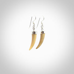 Hand made mammoth tusk drop earrings. Made by NZ Pacific - handmade jewellery for sale online. Woolly Mammoth Tusk fang style earrings, packaged in a woven kete pouch.