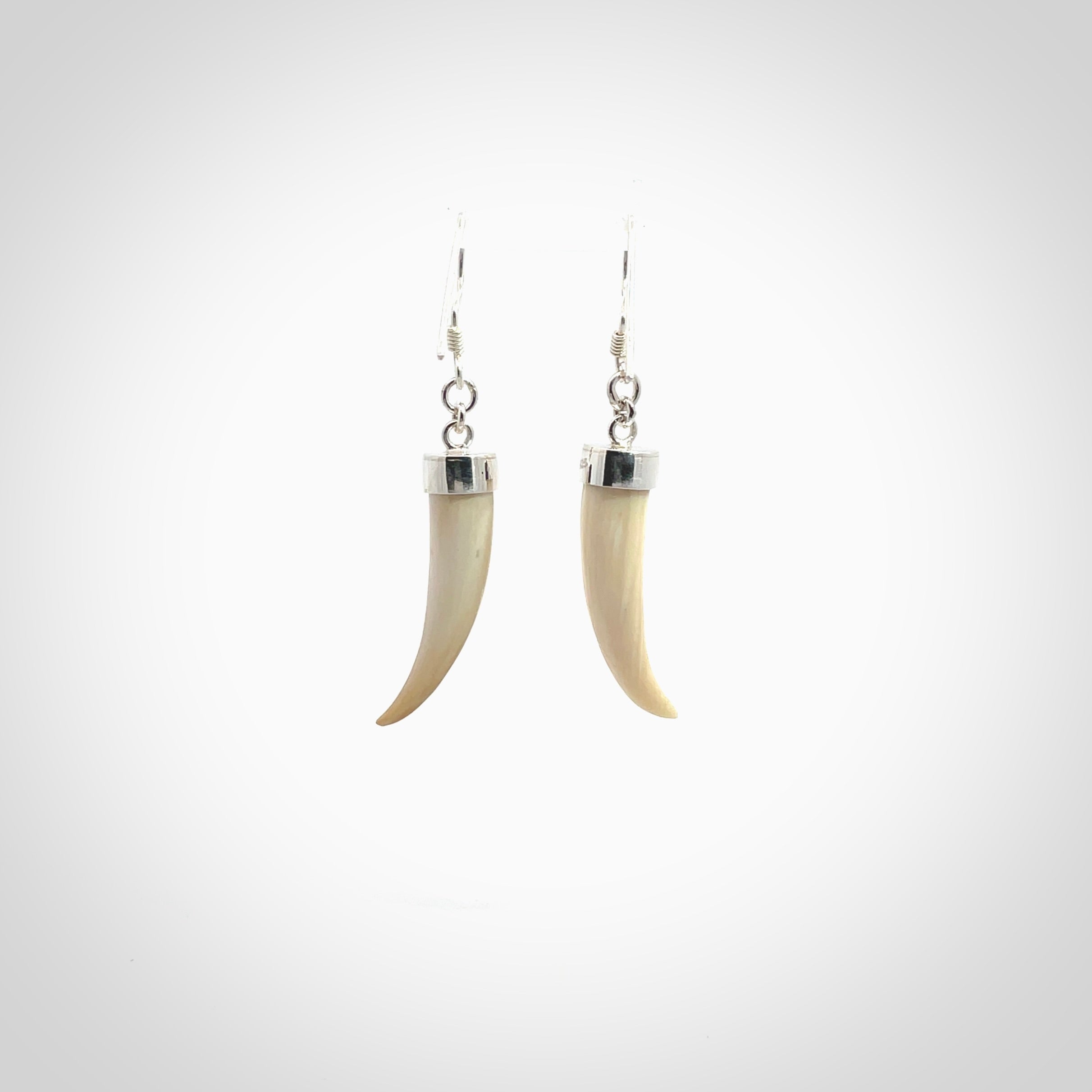 Hand made mammoth tusk drop earrings. Made by NZ Pacific - handmade jewellery for sale online. Woolly Mammoth Tusk fang style earrings, packaged in a woven kete pouch.