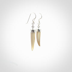 Hand made mammoth tusk drop earrings. Made by NZ Pacific - handmade jewellery for sale online. Woolly Mammoth Tusk fang style earrings, packaged in a woven kete pouch.