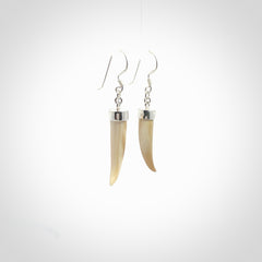 Hand made mammoth tusk drop earrings. Made by NZ Pacific - handmade jewellery for sale online. Woolly Mammoth Tusk fang style earrings, packaged in a woven kete pouch.