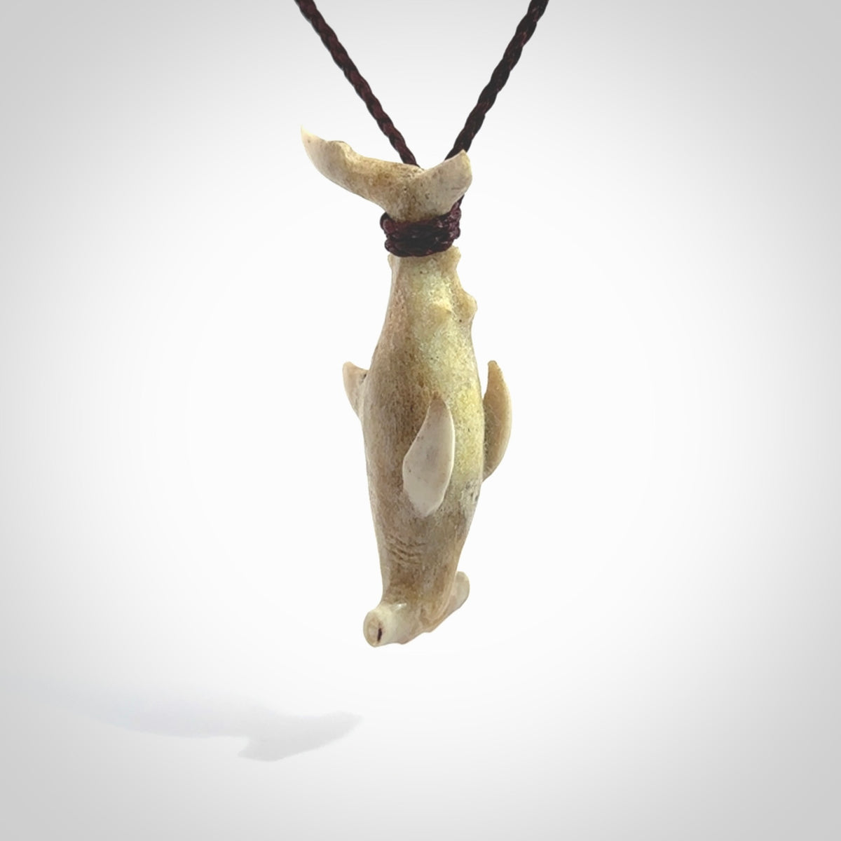 Winghead or hammerhead shark pendant. Handcarved from deer antler by NZ Pacific. Handcarved bone jewellery for sale online.