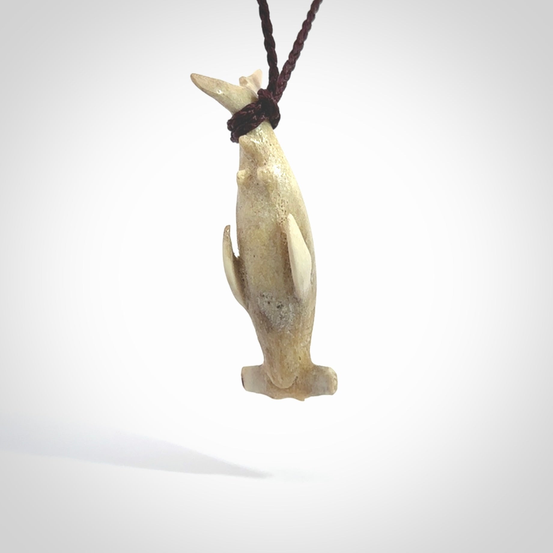 Winghead or hammerhead shark pendant. Handcarved from deer antler by NZ Pacific. Handcarved bone jewellery for sale online.