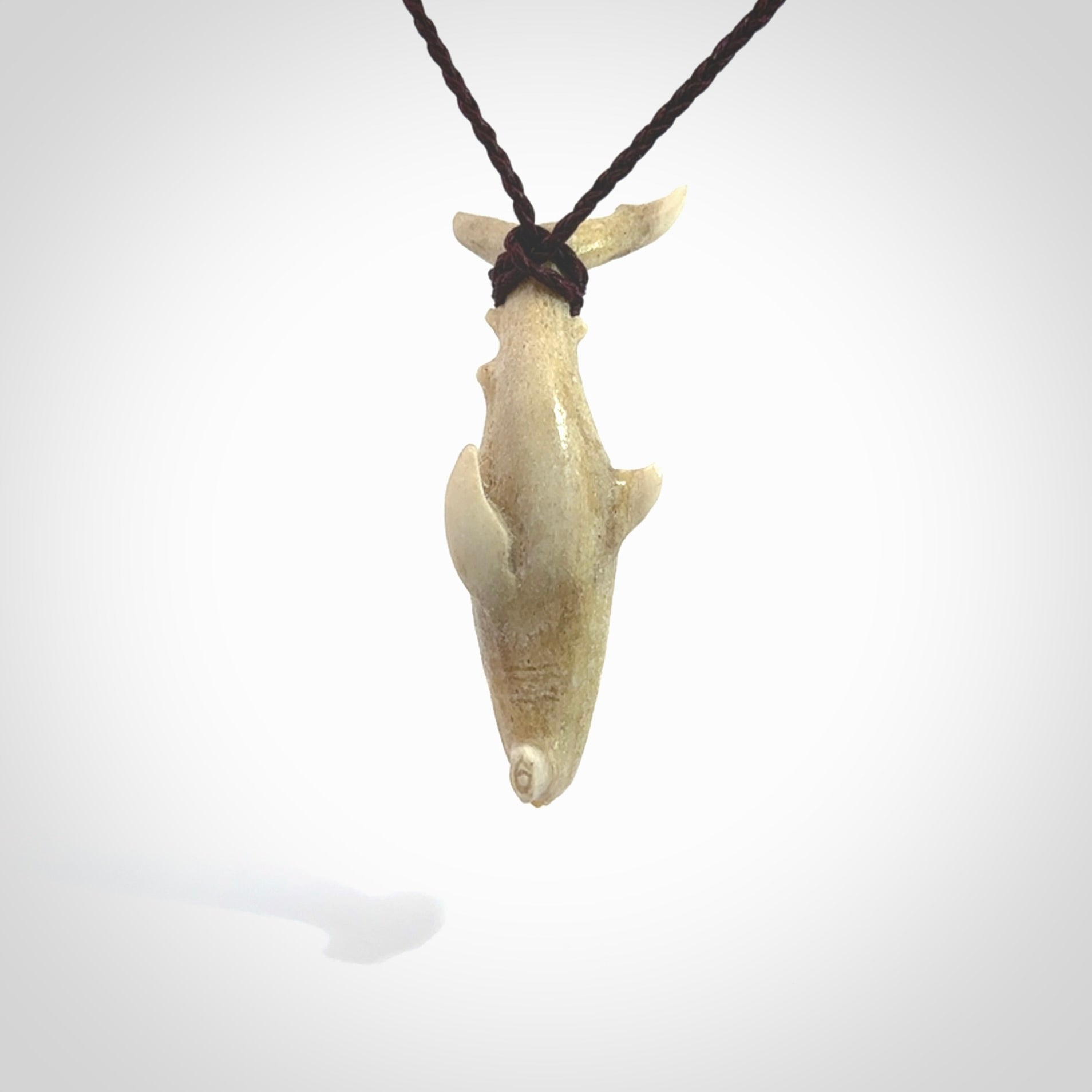 Winghead or hammerhead shark pendant. Handcarved from deer antler by NZ Pacific. Handcarved bone jewellery for sale online.