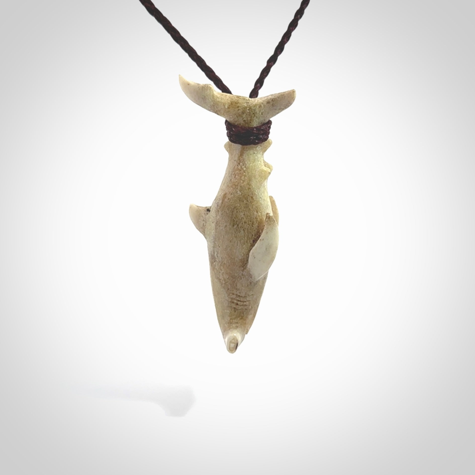 Winghead or hammerhead shark pendant. Handcarved from deer antler by NZ Pacific. Handcarved bone jewellery for sale online.