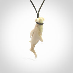 Winghead or hammerhead shark pendant. Handcarved from deer antler by NZ Pacific. Handcarved bone jewellery for sale online. Provided with adjustable olive cord.