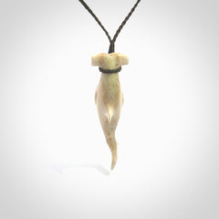 Winghead or hammerhead shark pendant. Handcarved from deer antler by NZ Pacific. Handcarved bone jewellery for sale online. Provided with adjustable olive cord.