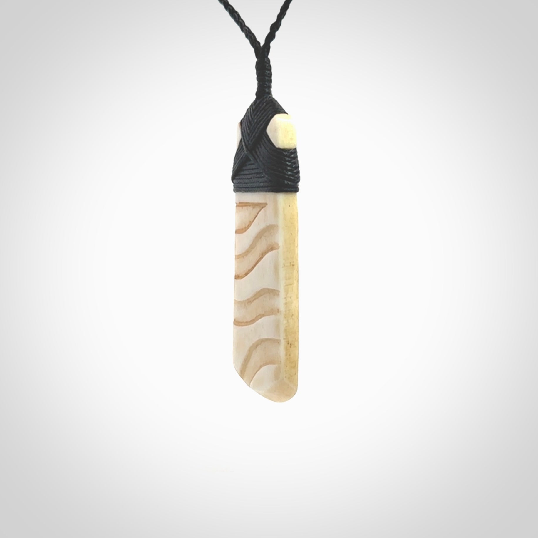 Hand carved Bone toki by Yuri Terenyi. Hand carved for NZ Pacific. Hand carved bone jewellery for sale online. Unique handmade jewellery.