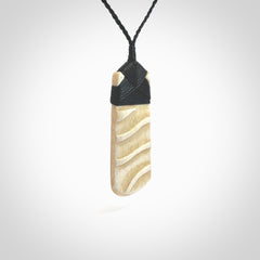 Hand carved Bone toki by Yuri Terenyi. Hand carved for NZ Pacific. Hand carved bone jewellery for sale online. Unique handmade jewellery.