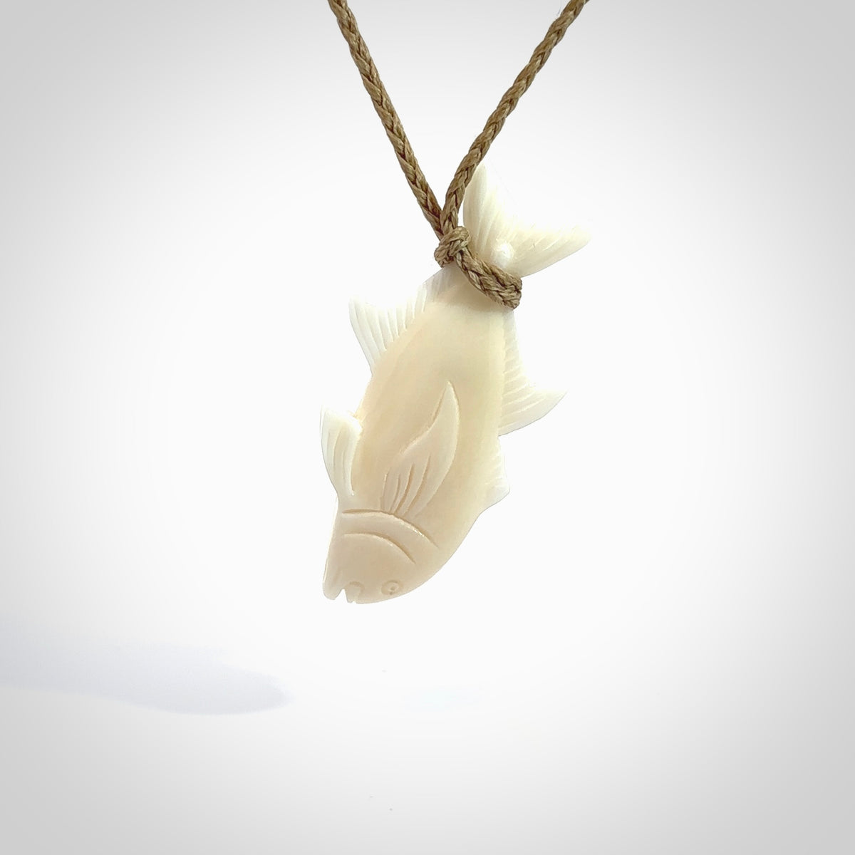 Hand carved bone fish pendant. Hand made bone fish necklace. Fish themed jewellery. Ocean themed pendant. Bone fish necklace provided with adjustable cord and free delivery.