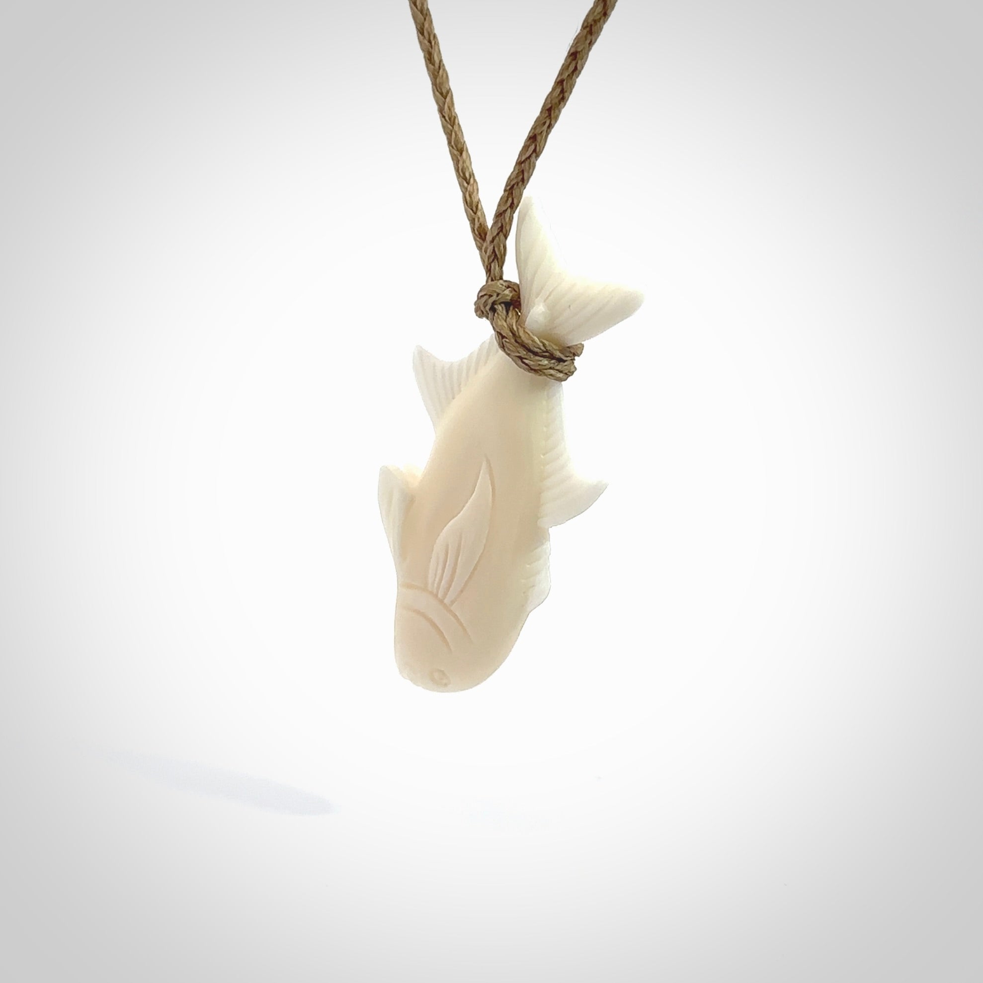 Hand carved bone fish pendant. Hand made bone fish necklace. Fish themed jewellery. Ocean themed pendant. Bone fish necklace provided with adjustable cord and free delivery.