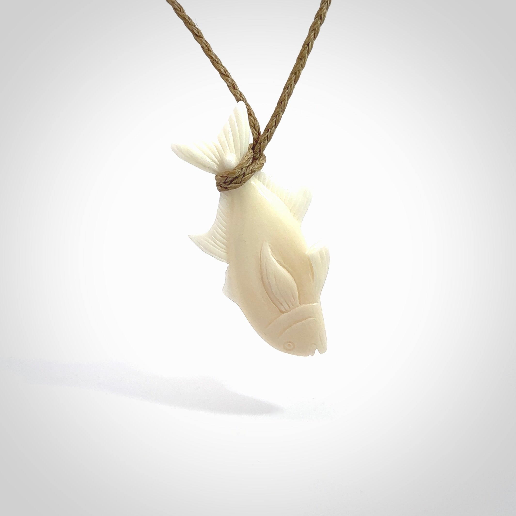 Hand carved bone fish pendant. Hand made bone fish necklace. Fish themed jewellery. Ocean themed pendant. Bone fish necklace provided with adjustable cord and free delivery.